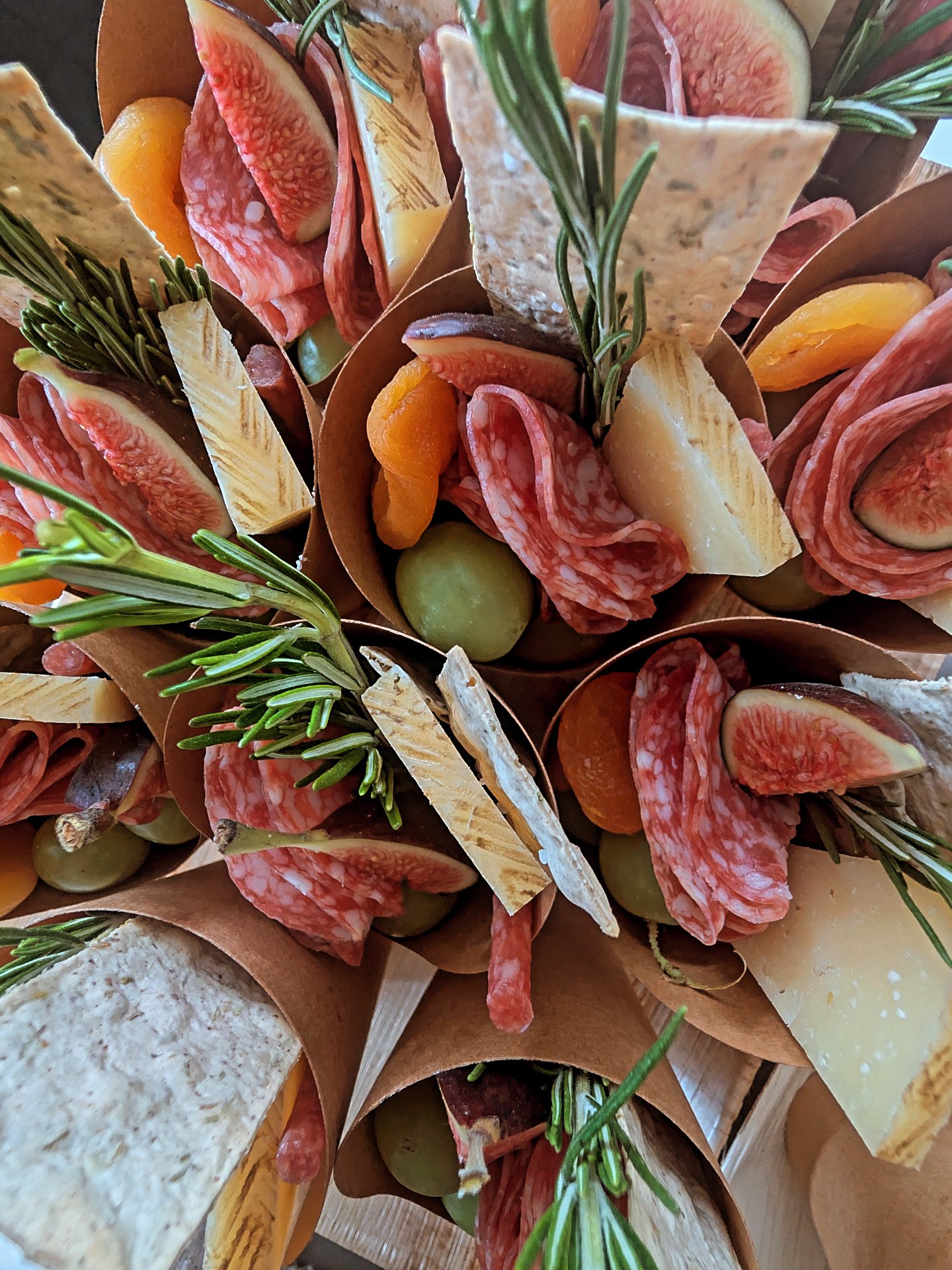 Charcuterie cones with salami, cheese, figs and rosemary